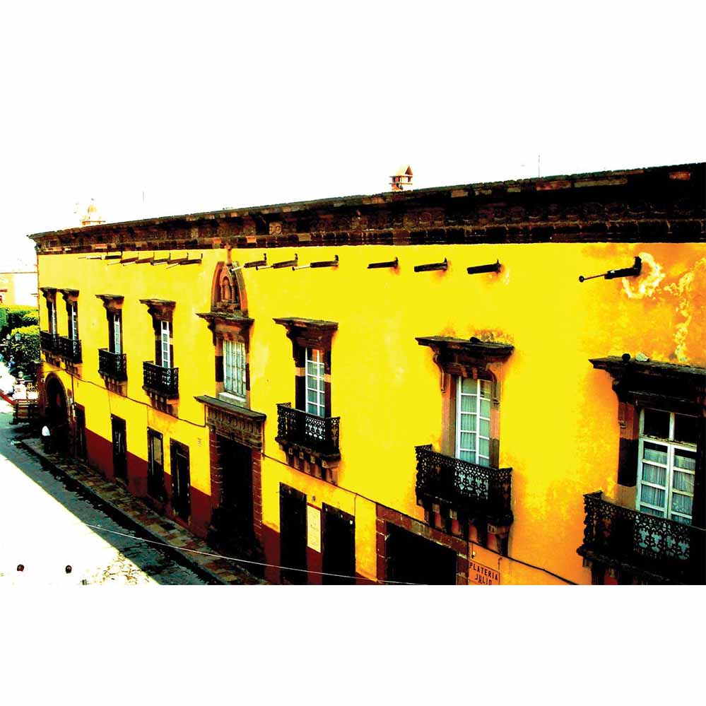 Yellow Mexican hotel with dark brown accents wall decal printed | Wallhogs