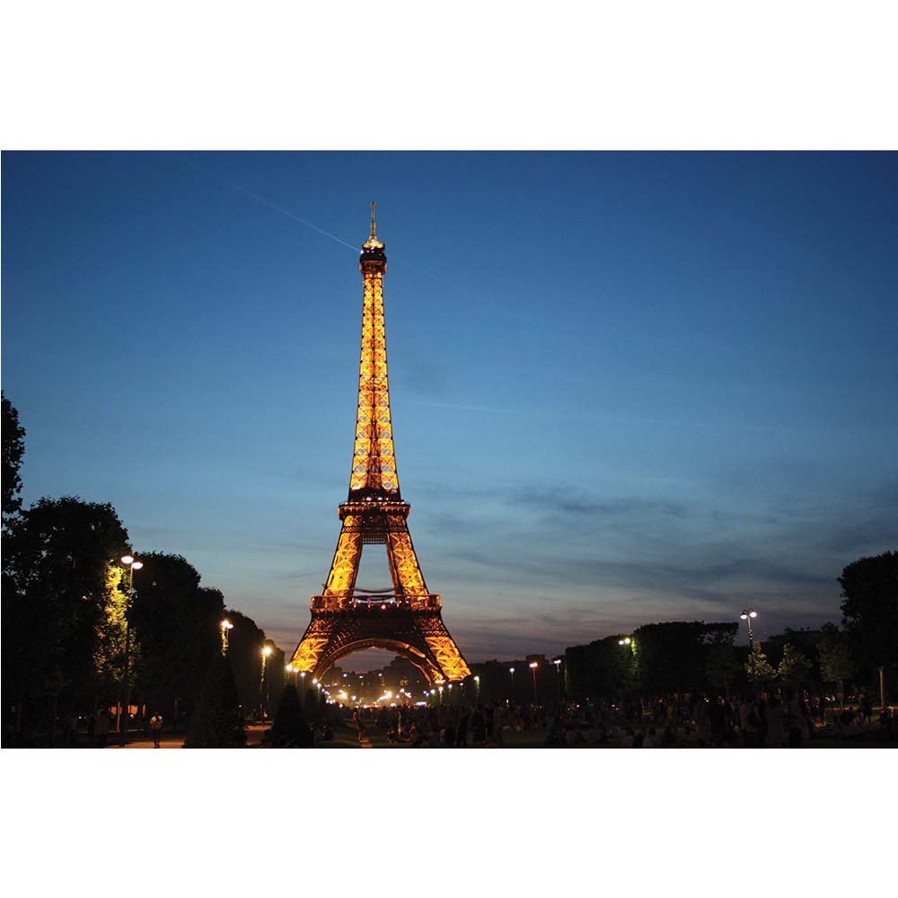 Eiffel Tower illuminated at dusk with a clear sky gloss poster printed | Wallhogs