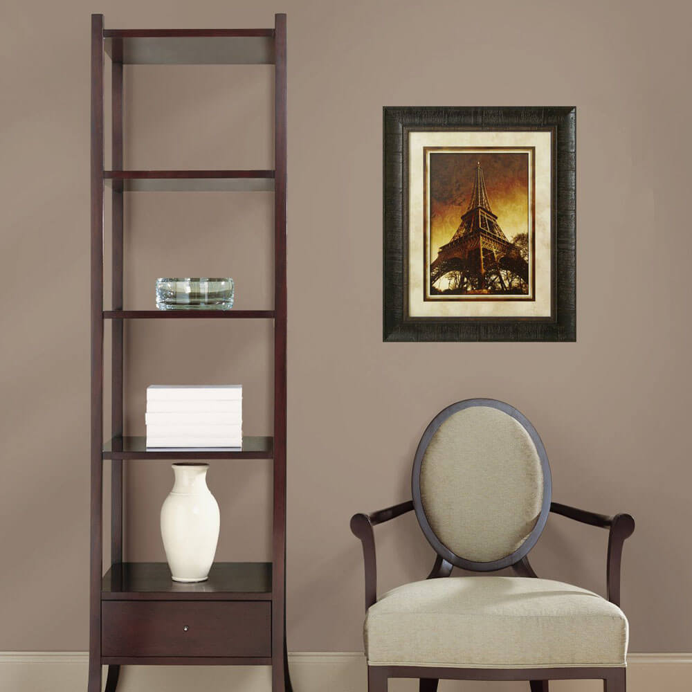Eiffel Evening Framed Art Installed Above Chair in a Sitting Area